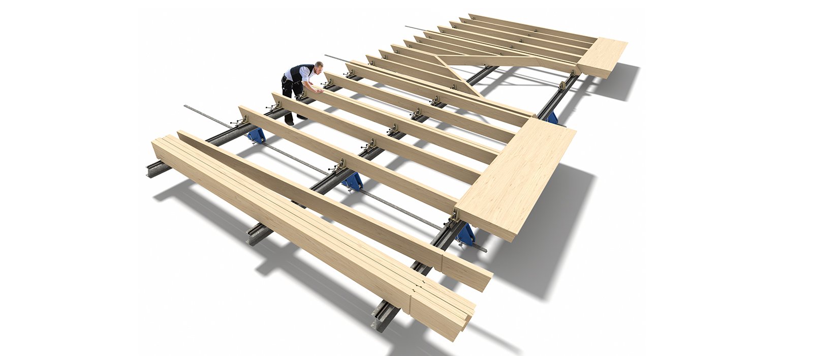 Die Vorfertigungsanlage tectofix mit einem Arbeiter der darauf ein Modul für ein Haus montiert.